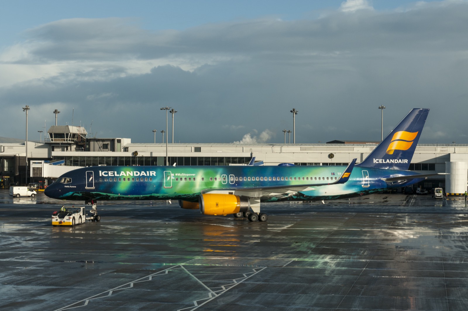 Airliners on a wet apron at night
